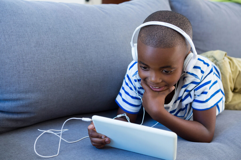 Child takes quiet time with his headphones