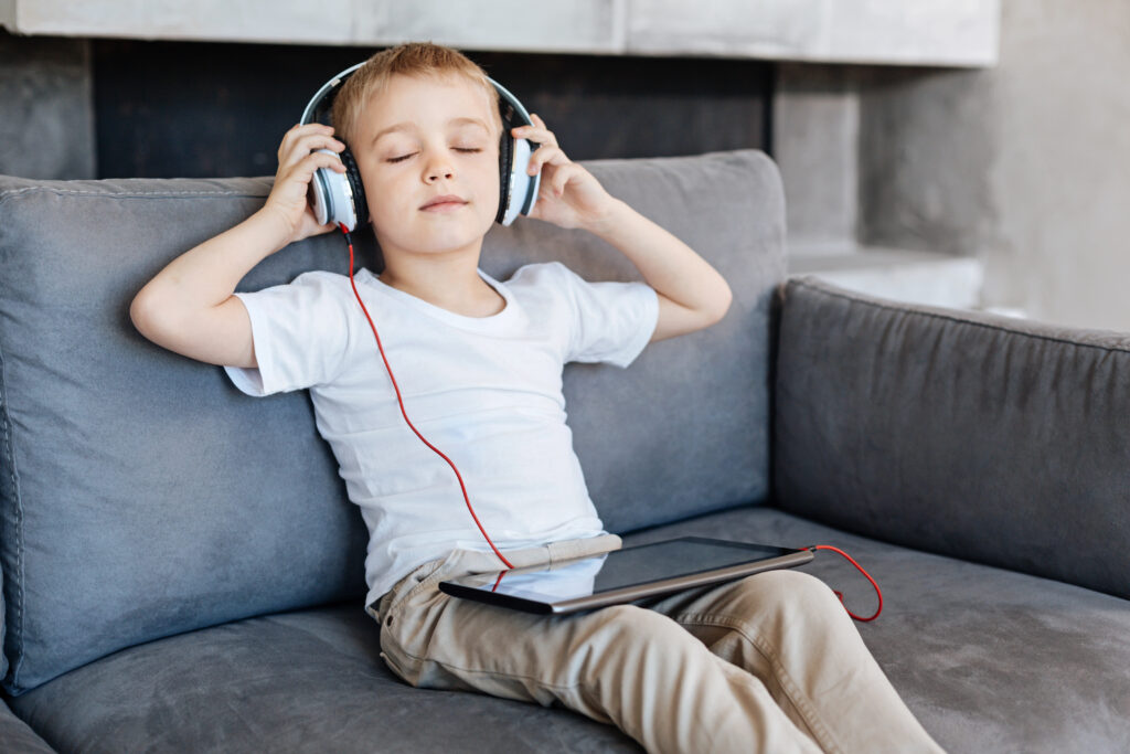 Child takes a break with headphones