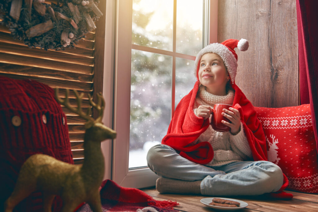 Little girl finds comfort in blanket and cocoa
