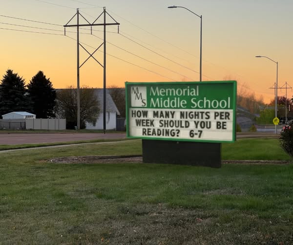 Sign reads "How many nights per week should you be reading? 6-7"