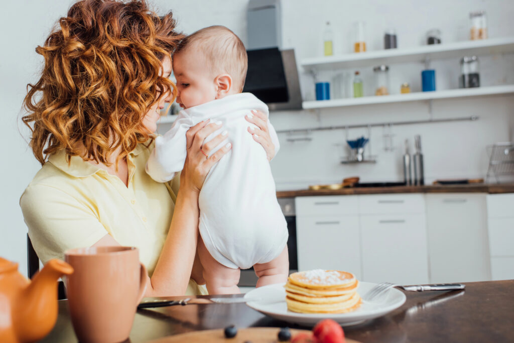 Mom is stressed and can't eat meal because baby needs to be held